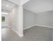 Hallway with tile flooring provides access to the various rooms in the home at 35 Peterlee Ct, Kissimmee, FL 34758