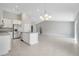 Spacious open-concept kitchen with stainless steel appliances, granite countertops, and ample counter space at 35 Peterlee Ct, Kissimmee, FL 34758