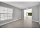 Bright living room with large window and tile flooring leading to the backyard at 35 Peterlee Ct, Kissimmee, FL 34758