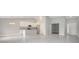 Open concept living space with ceramic tile flooring, soaring ceilings, and abundant natural light at 35 Peterlee Ct, Kissimmee, FL 34758