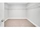 Spacious walk-in closet with carpeted floor and wire shelving installed at 35 Peterlee Ct, Kissimmee, FL 34758