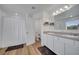 Bathroom featuring double sinks, ample counter space, and a shower/tub combination at 355 Churchill Ct, Kissimmee, FL 34759