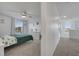 Bright bedroom with a ceiling fan, large window, and light gray carpeting at 355 Churchill Ct, Kissimmee, FL 34759
