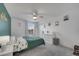This is a bedroom with a large window and modern ceiling fan at 355 Churchill Ct, Kissimmee, FL 34759