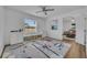 Spacious bedroom with airplane themed rug, ceiling fan, and plenty of natural light at 355 Churchill Ct, Kissimmee, FL 34759