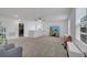 Well-lit bonus room with plush carpeting, entertainment area, perfect for creating a cozy atmosphere at 355 Churchill Ct, Kissimmee, FL 34759
