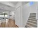 Entryway features a view to an open kitchen and dining area, as well as the stairway at 355 Churchill Ct, Kissimmee, FL 34759