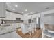 Stylish kitchen showcases white cabinets, granite countertops, stainless steel appliances, and ample lighting at 355 Churchill Ct, Kissimmee, FL 34759