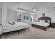 Inviting bedroom with tray ceiling, ceiling fan, and natural light showcasing a comfortable retreat at 355 Churchill Ct, Kissimmee, FL 34759
