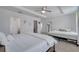 Comfortable bedroom with carpeted floors, with natural lighting, with ensuite bathroom, walk-in closet, and plush bed at 355 Churchill Ct, Kissimmee, FL 34759