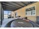 Covered patio featuring an inflatable hot tub and grill, perfect for outdoor entertainment at 355 Churchill Ct, Kissimmee, FL 34759