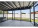 Screened lanai showing the open layout and the fenced yard view at 355 Churchill Ct, Kissimmee, FL 34759