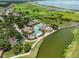 Stunning aerial view of community amenities including a luxurious pool area and waterfront access at 3856 Shoreside Dr, Kissimmee, FL 34746