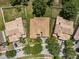 Aerial view of a landscaped neighborhood with lush backyards and tile roofs at 3856 Shoreside Dr, Kissimmee, FL 34746