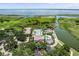 Expansive aerial view of the community pool, clubhouse, and picturesque waterfront at 3856 Shoreside Dr, Kissimmee, FL 34746