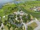 Breathtaking aerial view featuring a community pool, clubhouse, walking trails, and a serene lake at 3856 Shoreside Dr, Kissimmee, FL 34746