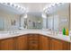 Spacious bathroom with double sinks, vanity, large mirror, and glass enclosed shower at 3856 Shoreside Dr, Kissimmee, FL 34746