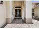 Stately entrance featuring a decorative glass door, brick pavers, and elegant architectural details at 3856 Shoreside Dr, Kissimmee, FL 34746