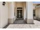 Inviting entryway with pillars and tile flooring leads to a stained glass front door that welcomes you home at 3856 Shoreside Dr, Kissimmee, FL 34746