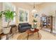 Comfortable living room with bright natural light, stylish decor, neutral tones and comfortable seating at 3856 Shoreside Dr, Kissimmee, FL 34746