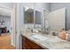 Stylish bathroom featuring a marble countertop vanity, mirror, and modern fixtures for a refreshing experience at 4056 Ashton Club Dr, Lake Wales, FL 33859