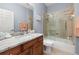 Modern bathroom with marble countertop vanity, and a shower with glass enclosure for a spa-like experience at 4056 Ashton Club Dr, Lake Wales, FL 33859
