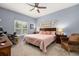 Comfortable bedroom features carpet, a ceiling fan, and a queen-size bed at 4056 Ashton Club Dr, Lake Wales, FL 33859