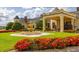 Exterior shot of the luxurious clubhouse, showcasing a beautiful fountain and vibrant landscaping at 4056 Ashton Club Dr, Lake Wales, FL 33859