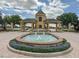 View of the Lake Ashton community entrance featuring a decorative fountain and well-maintained landscaping at 4056 Ashton Club Dr, Lake Wales, FL 33859
