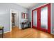 Bright foyer featuring hardwood floors, stylish double doors, and a view to the bathroom at 4056 Ashton Club Dr, Lake Wales, FL 33859