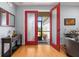 Inviting foyer with hardwood floors, double glass doors, and stylish decor at 4056 Ashton Club Dr, Lake Wales, FL 33859