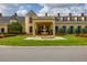 Stunning home exterior with a welcoming water fountain and beautifully landscaped front yard at 4056 Ashton Club Dr, Lake Wales, FL 33859