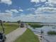 Golf cart riding near a lake and golf course at 4056 Ashton Club Dr, Lake Wales, FL 33859