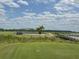 Golf course view showcasing lush greens and a picturesque bridge at 4056 Ashton Club Dr, Lake Wales, FL 33859