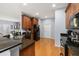 Well-equipped kitchen with dark countertops, stainless appliances, and hardwood floors at 4056 Ashton Club Dr, Lake Wales, FL 33859