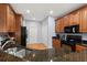Spacious kitchen with dark countertops, modern appliances, and hardwood floors at 4056 Ashton Club Dr, Lake Wales, FL 33859
