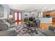 Comfortable living room featuring hardwood floors, stylish decor, and comfortable gray seating at 4056 Ashton Club Dr, Lake Wales, FL 33859