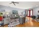 Open living area with stylish decor, hardwood floors, and comfortable gray seating at 4056 Ashton Club Dr, Lake Wales, FL 33859
