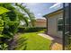 Well-maintained yard with lush landscaping and brick pathway leading to the home at 4056 Ashton Club Dr, Lake Wales, FL 33859