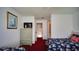 Bright bedroom with twin beds, a wardrobe, and a view into the landing, offering a comfortable and functional space at 408 Bloomingdale Dr, Davenport, FL 33897
