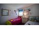 A bedroom featuring twin beds with Disney-themed decor at 408 Bloomingdale Dr, Davenport, FL 33897