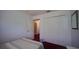 A bedroom with carpet and a closet featuring a pair of sliding doors at 408 Bloomingdale Dr, Davenport, FL 33897