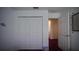 A bedroom with carpet and a closet featuring a pair of sliding doors at 408 Bloomingdale Dr, Davenport, FL 33897