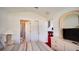 Relaxing bedroom showcases an ensuite bath and entertainment area with a TV and foosball table at 408 Bloomingdale Dr, Davenport, FL 33897
