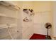 Walk-in closet with white wire shelving and a clothing rack at 408 Bloomingdale Dr, Davenport, FL 33897
