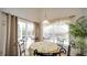 Bright breakfast nook featuring a table for six and views of the backyard at 408 Bloomingdale Dr, Davenport, FL 33897