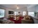 Spacious living room with vaulted ceilings, a ceiling fan, and a TV at 408 Bloomingdale Dr, Davenport, FL 33897