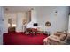 Spacious living room with a foosball table and stairs leading to the upper level at 408 Bloomingdale Dr, Davenport, FL 33897