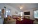 Spacious living room with vaulted ceilings, and a TV at 408 Bloomingdale Dr, Davenport, FL 33897