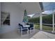 Cozy outdoor patio featuring a table with an umbrella and chair set, perfect for relaxing at 408 Bloomingdale Dr, Davenport, FL 33897
